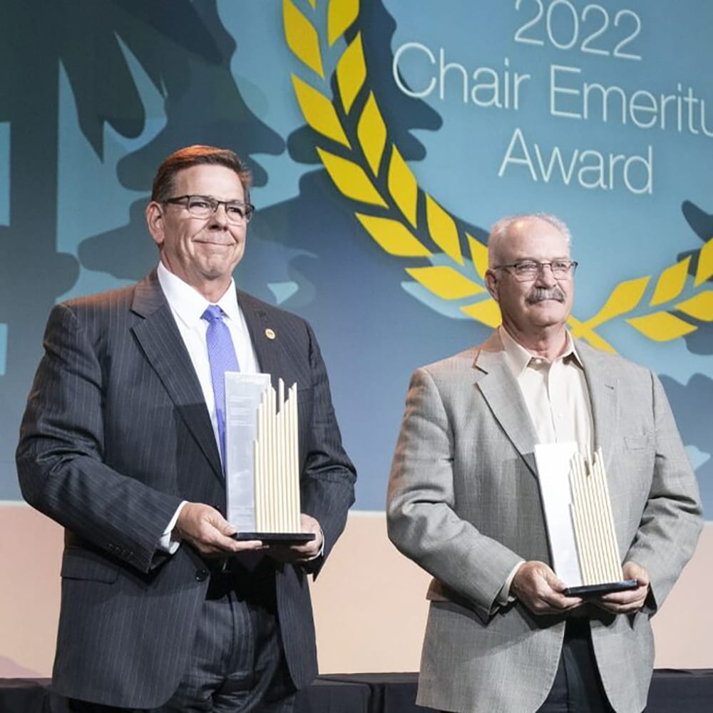 ACEC Members holding the Chair Emeritus Award trophy