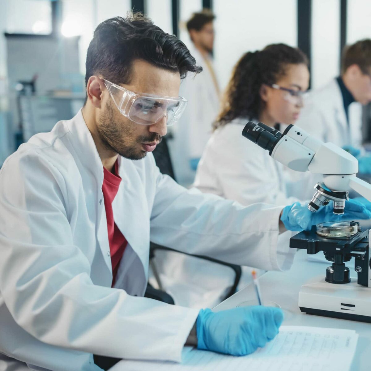 scientists and doctors working in lab