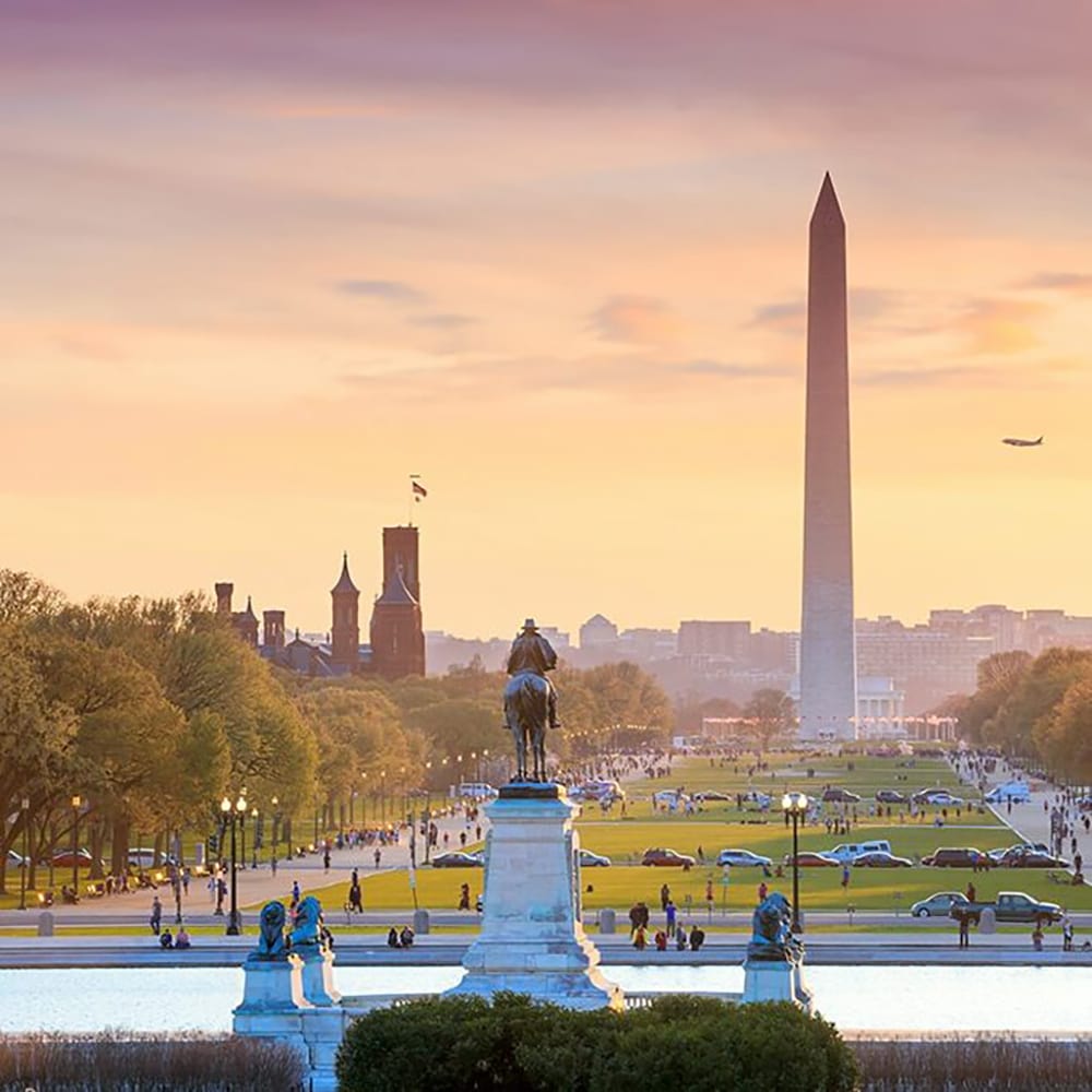 Washington dc city view orange sunset including Washington monument from capitol building